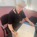 Woodley Town Mayor signs book of condolence