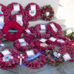 Poppy wreaths on the War Memorial in Woodford Park