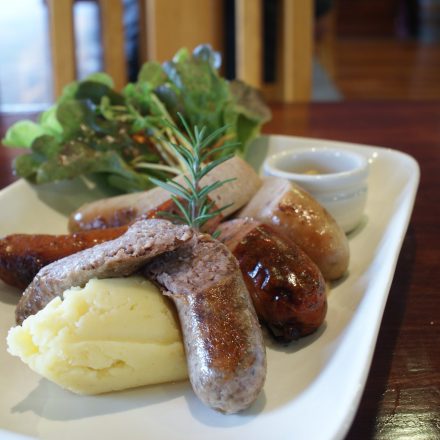 A plate of sausage and mash from Brown Bag