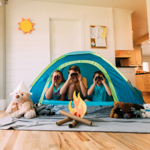 Children in a tent in their living room