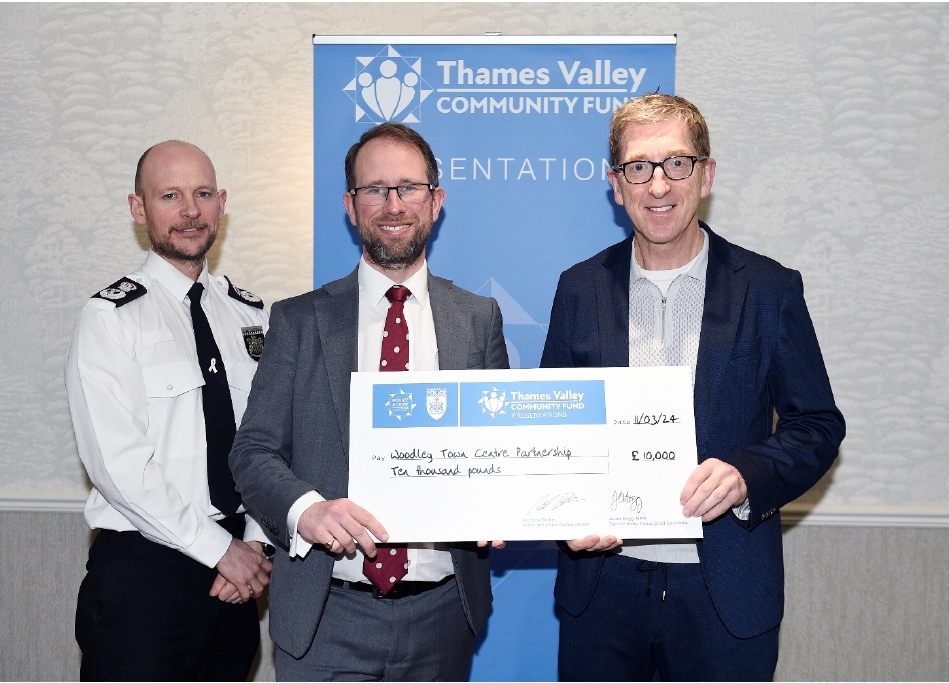 Town Centre Manager, Brian Fennelly, receiving a cheque from Matthew Barber, Police & Crime Commissioner for Thames Valley
